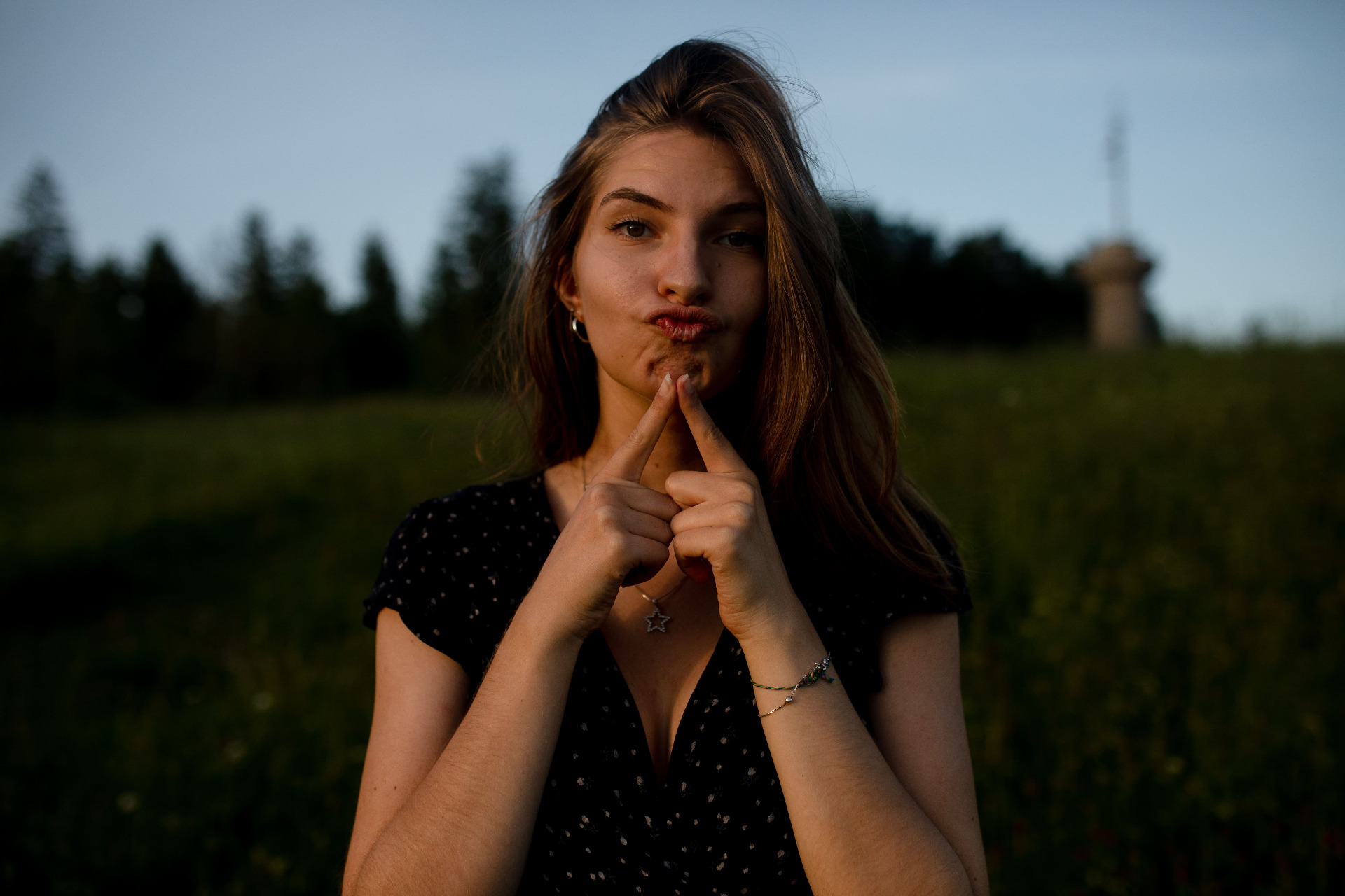 model posing funny on a field