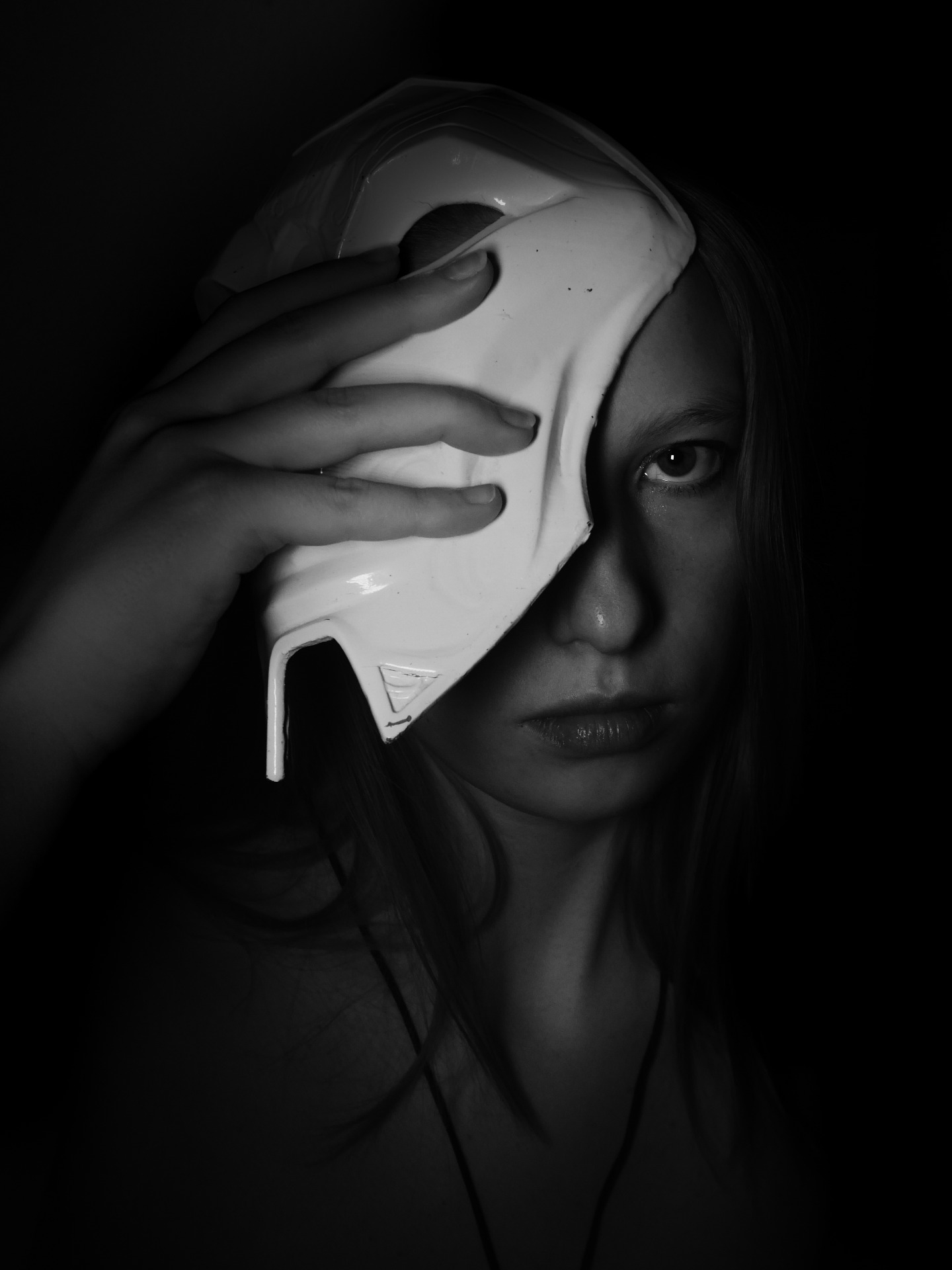 Girl behind mask black white