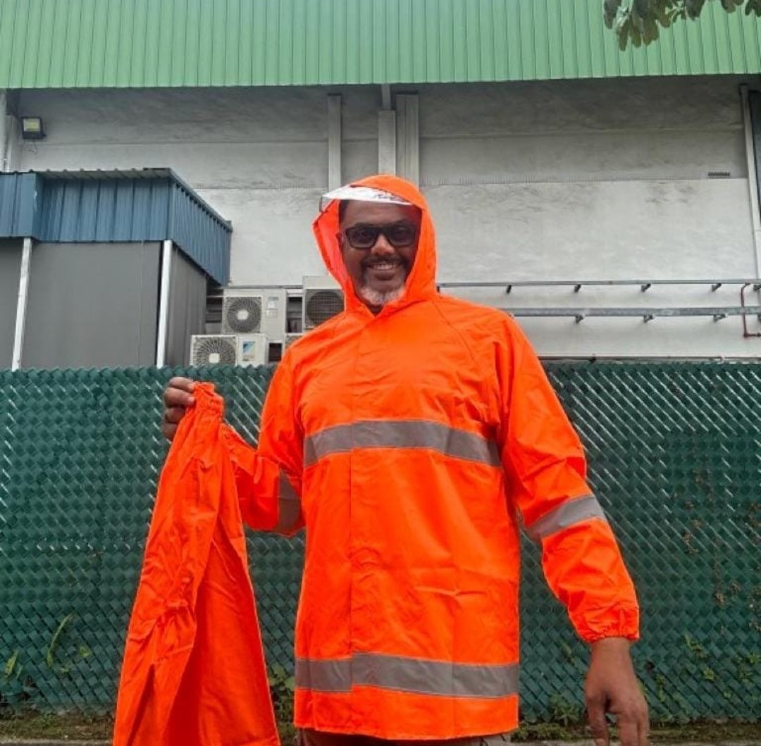 High visibility rain coat provided by CML.