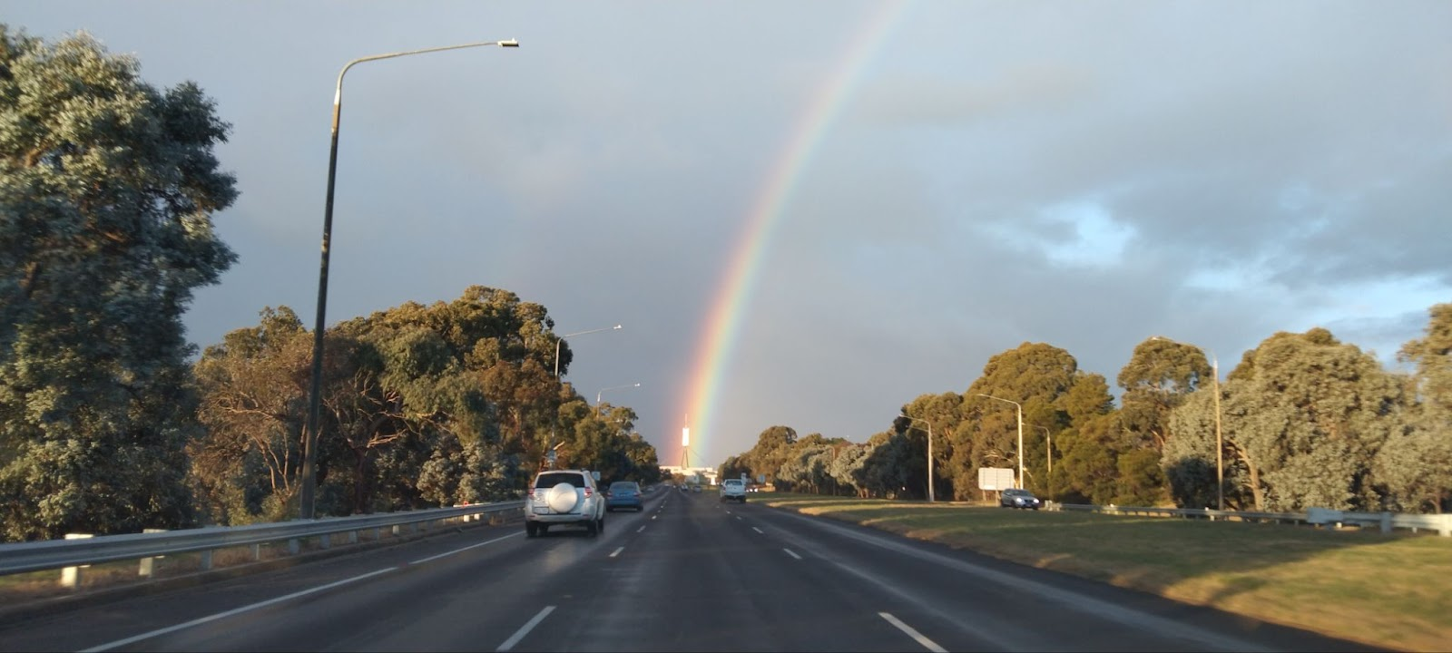 A picture that I took in Canberra. It shows the Parliament of Australia being aligned with a rainbow.