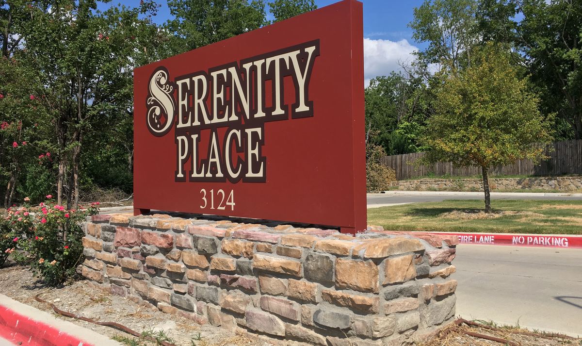 Serenity Place entrance sign on a Koni Canyon Stone base