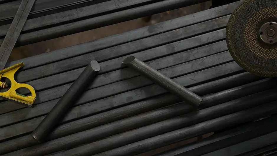 Hot-rolled round bars on a fabrication bench