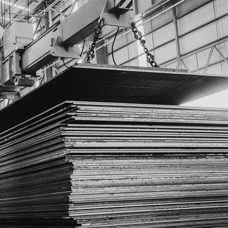 Steel plate stack being lifted