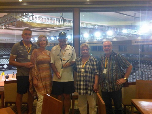 Jimmy Roland after being presented Ana Ivanovic winners racket by Ana&apos;s parents(on his left) and their friends