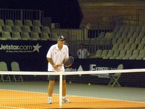 Jimmy Roland on court, playing doubles