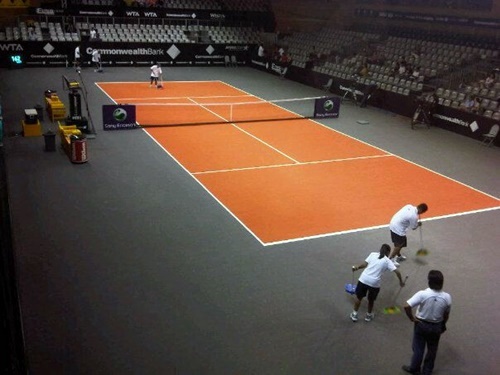 Players Service prepares the court