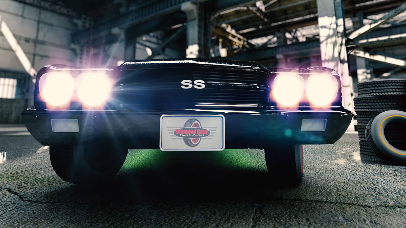Cinematic CGI rendering of a classic Chevrolet Chevelle SS with illuminated headlights inside an industrial warehouse, showcasing Diamond Back Classic Radial tires in a photorealistic automotive commercial by Digital Hyper Studios.
