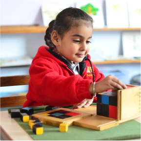 Montessori Student Playing with Equipments