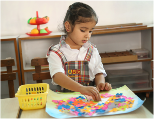 BIPS Montessori student playing with Equipment