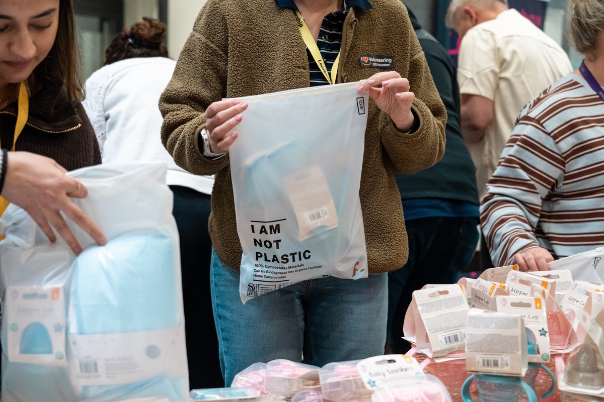 A volunteer completing a charity donation kit