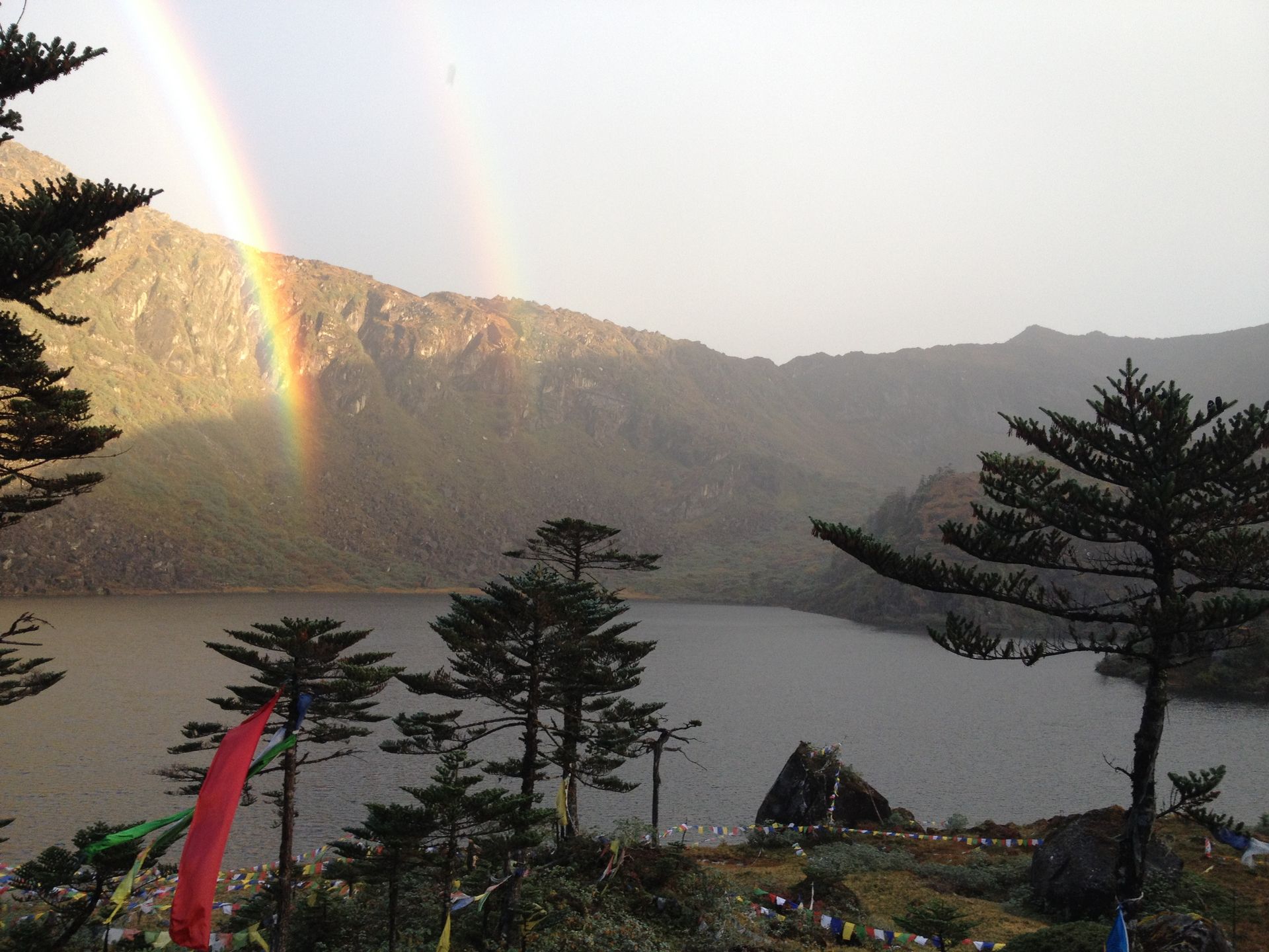 a double rainbow at danakosha lake while trekking in the beyul of pemako