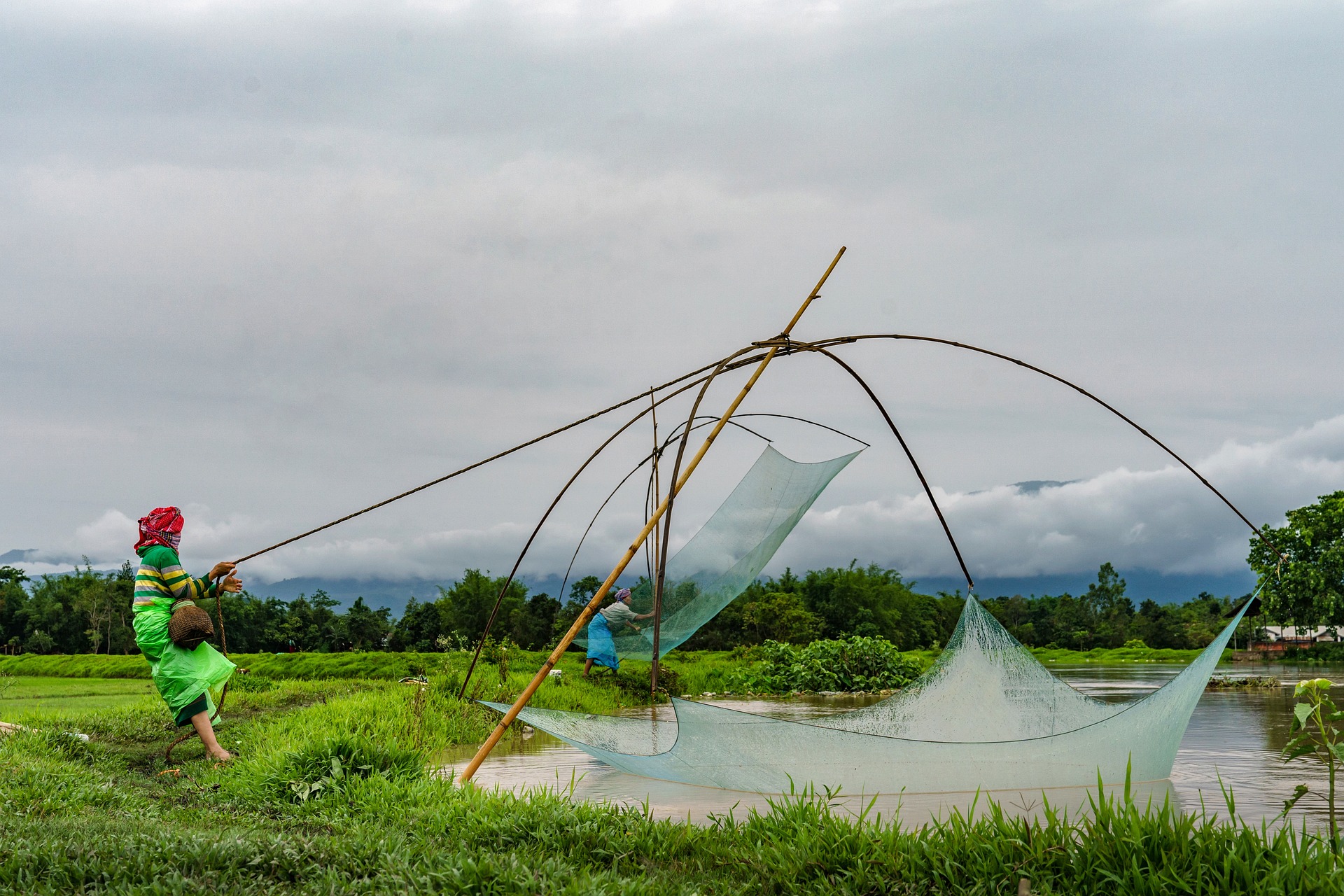 women fishing in a lake in manipur