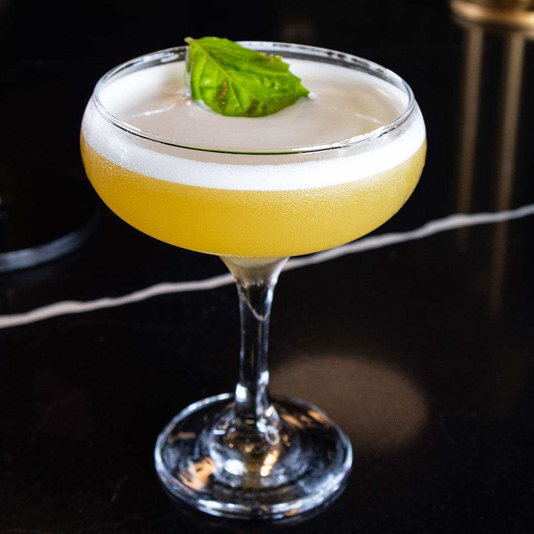 Basilico cocktail - Tito’s Vodka, St. George Basil, Peach, Lemon, Fee Foam